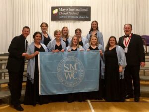 The Madrigals pose with their trophy at the festival