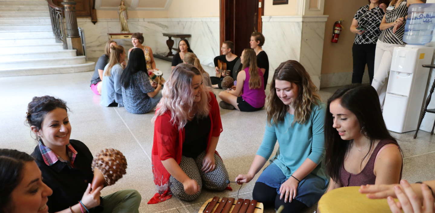 MAMT students playing instruments in the conservatory of music