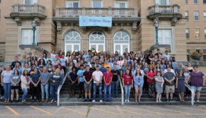 The incoming class standing on the steps of Le Fer Hall