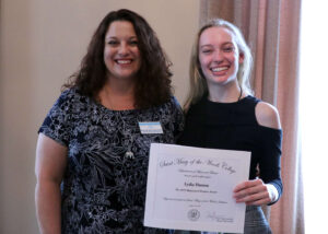 Huston and Boyle holding the Musician of Promise award