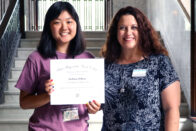 DeBaun and Boyle holding the Musician of Promise award