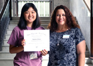 DeBaun and Boyle holding the Musician of Promise award