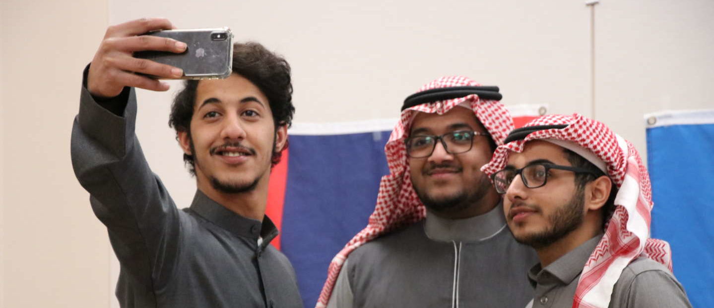 A group of students pose for a selfie during international week