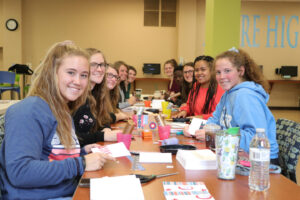 Student making cards in the student center