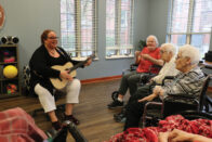 Natalie Coffin playing music for patients in Providence Health Care