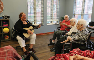 Natalie Coffin playing music for patients in Providence Health Care