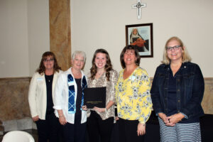 Alexis Allen accepting her scholarship certificate