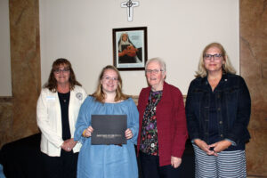 Allee Taylor accepting her scholarship certificate