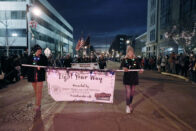 Students carrying banner at the start of the 2018 Christmas parade