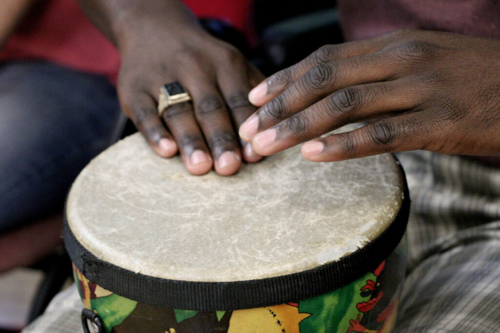 SMWC Master's student playing drum