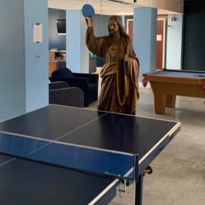 TJ playing ping pong in Le Fer Hall