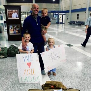 Clapp with his kids at the airport