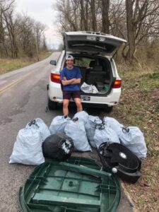 Jacob Turner with multiple bags full of cleaned up litter
