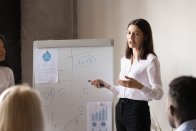 Woman presenting to group of professionals
