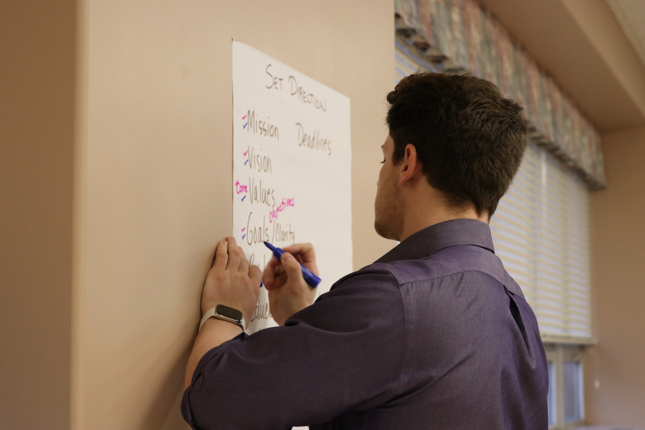 WVLI student taking notes during brainstorm