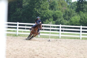 Hannah Rogers rides her horse.