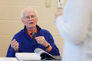 Dr. Paul speaking to a student