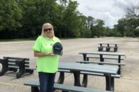 Kathy Kinney standing in front of the benches