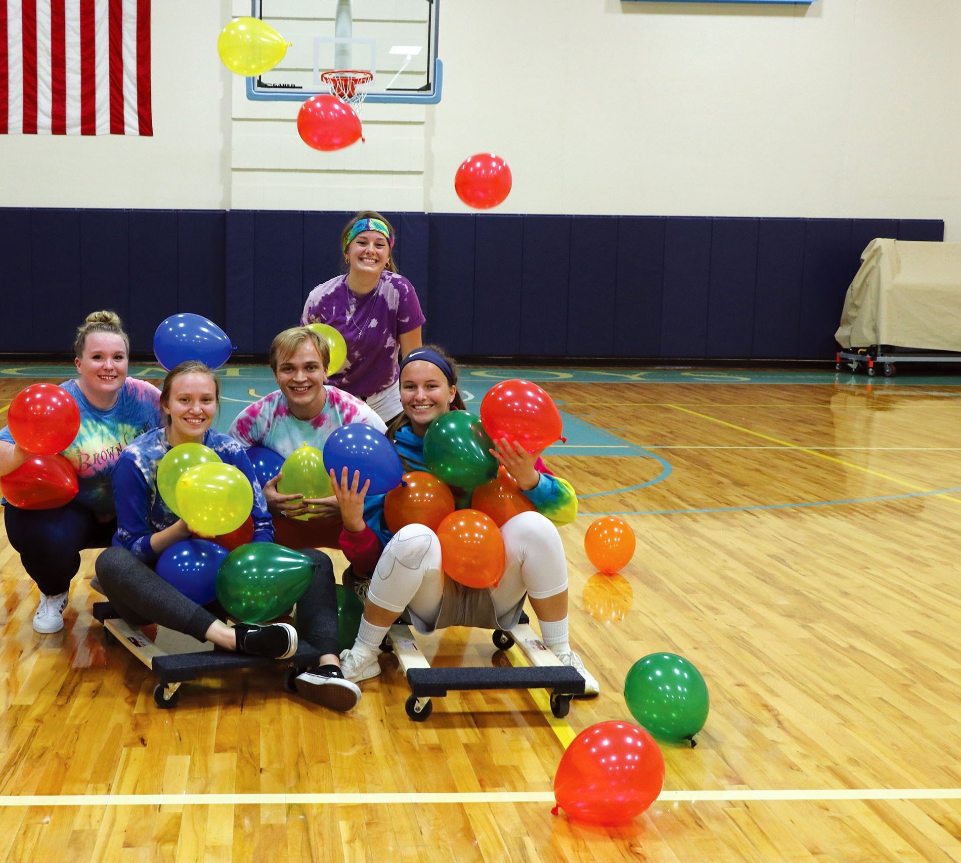 Students playing balloon game in the gym