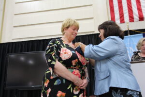 Wheeler receiving her pin