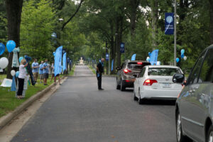 Staff greeting cars at move-in