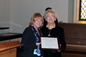 Sister Barbara and President King holding the scholarship