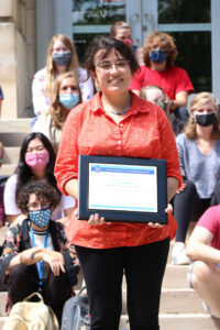 Julia Pastore holding the award