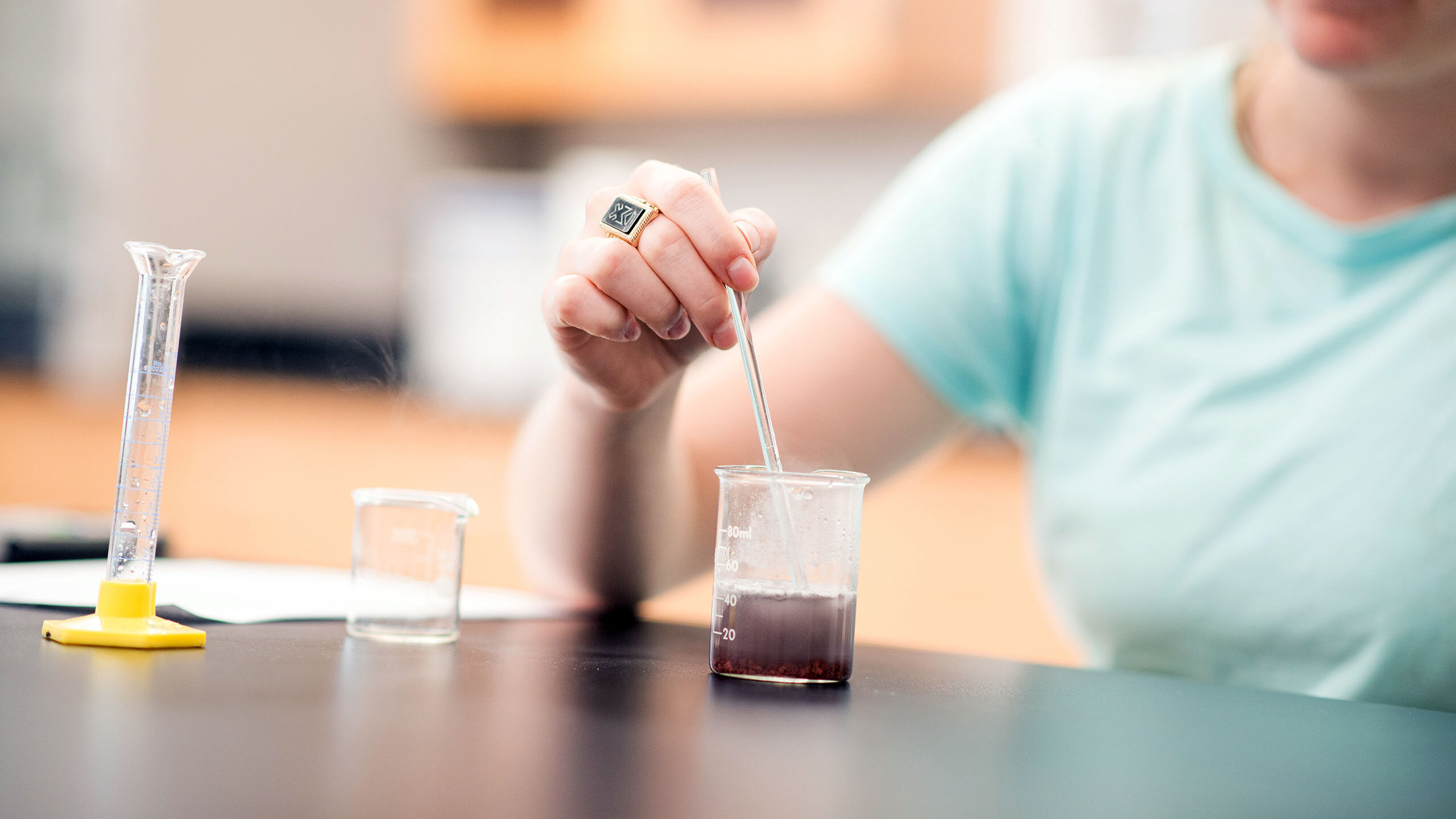 Student mixes things in beakers