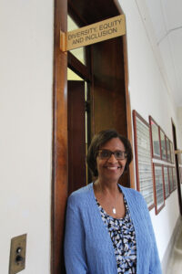 Dee Reed outside of the office of Diversity, Equity and Inclusion