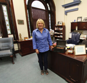 President Dottie L. King standing next to her desk