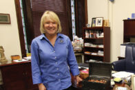 President Dottie L. King standing next to her desk