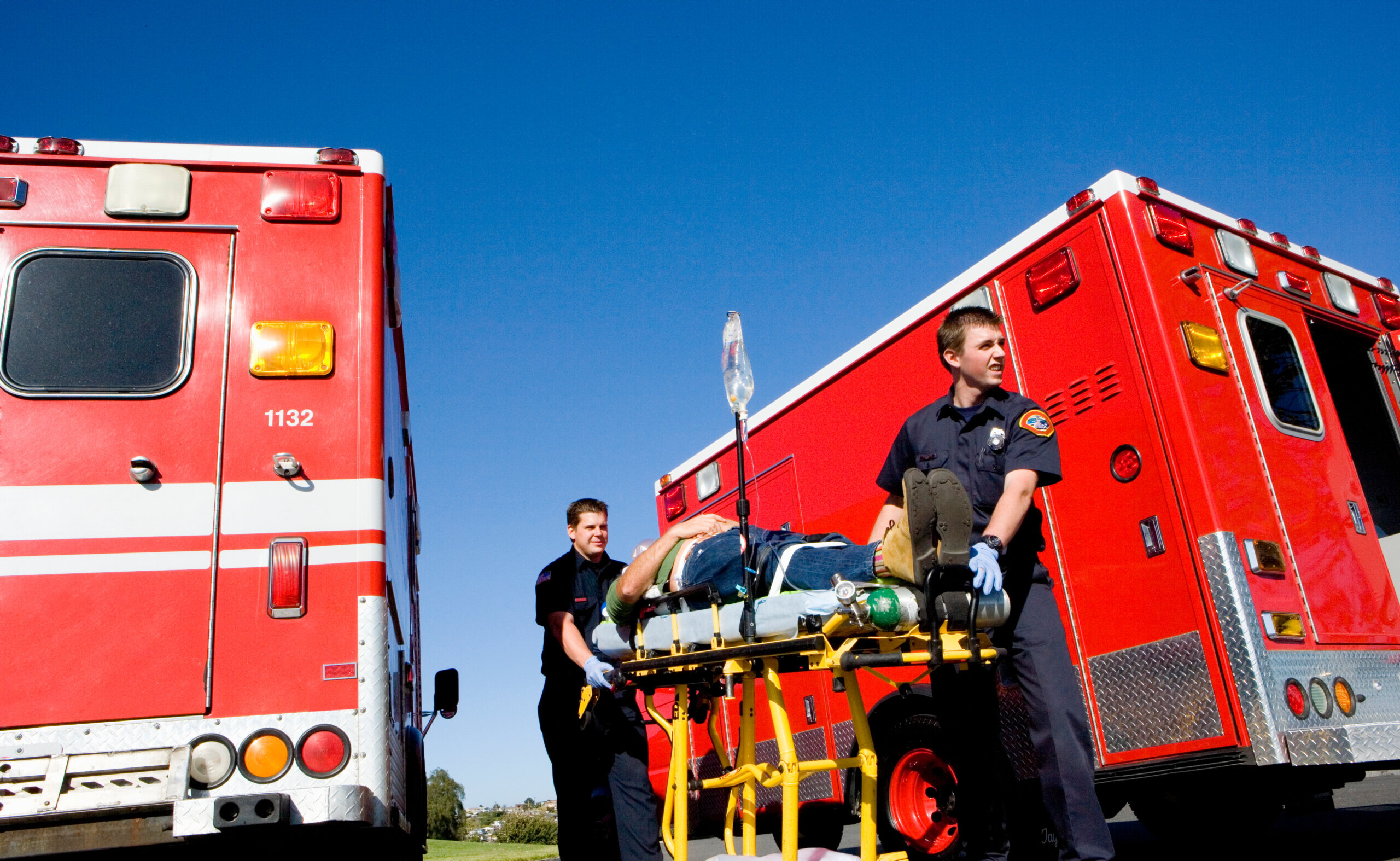 Paramedics with a patient on a stretcher