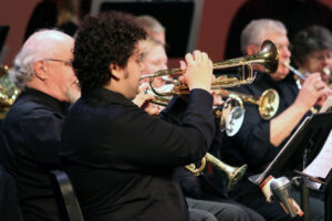 A student playing the trumpet during a concert