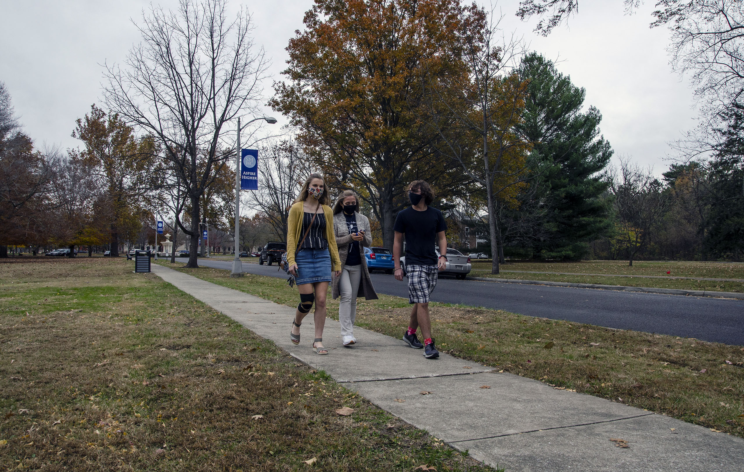 Three students walking down the Avenue