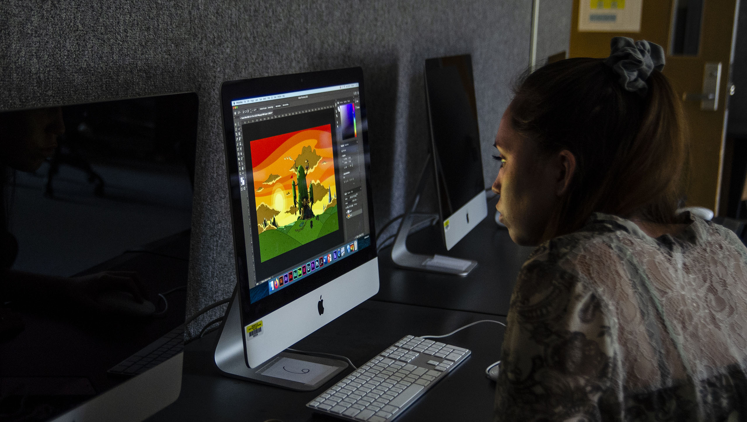 Student in computer lab working on digital art