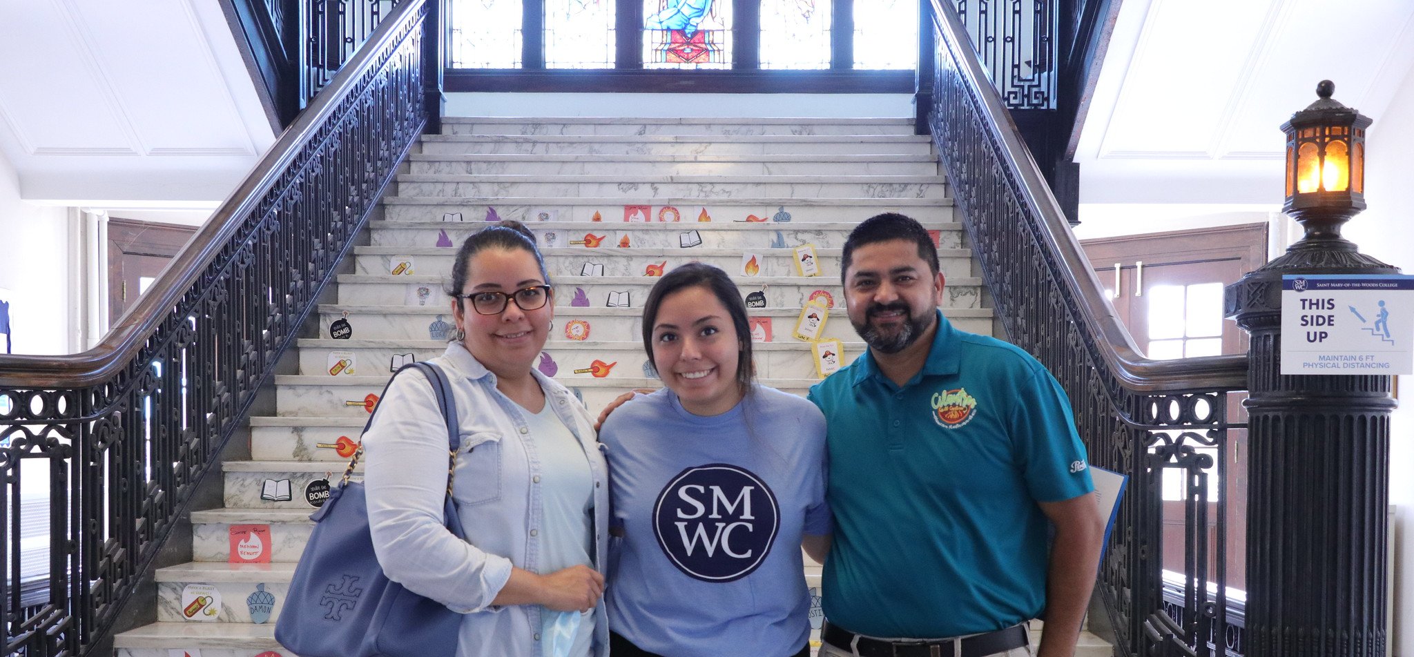 Family stands a student at move-in day