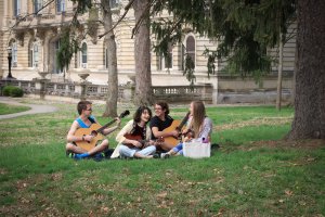 students on lawn playing instruments