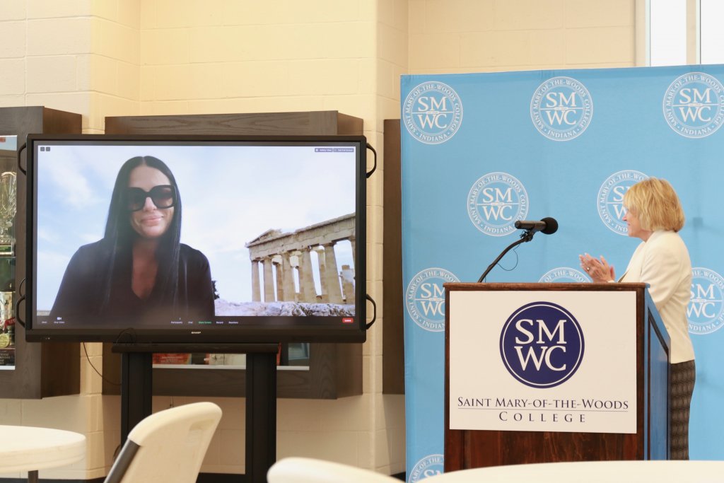 Dr. Pantazi on screen at press conference