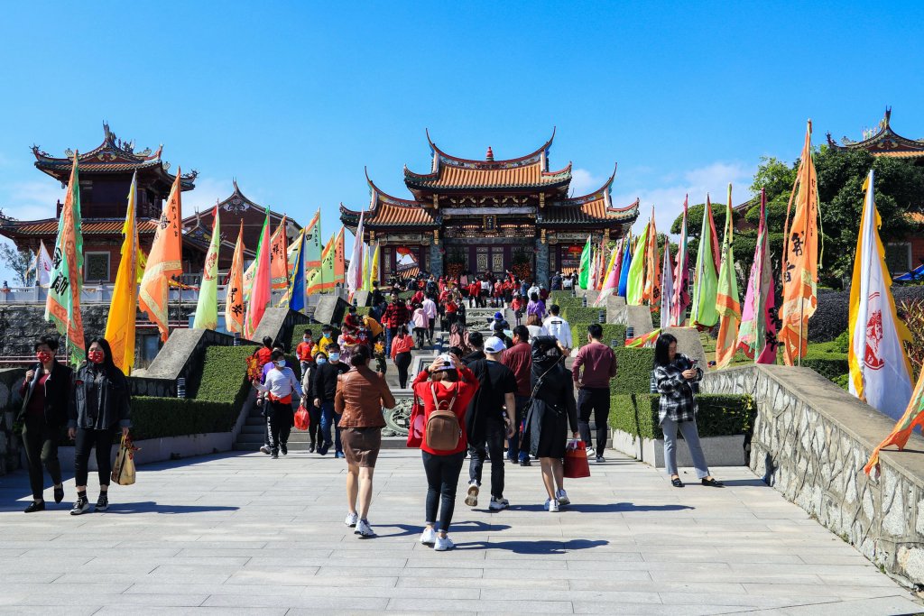 People in front of a temple in Macau