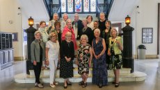 Reunion class gathered on the marble stairs