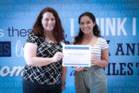 Sharon Boyle, left, presents the Musician of Promise scholarship to Joynelis Caminero Santiago.