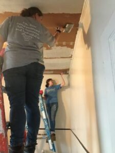 students painting a ceiling in New Orleans