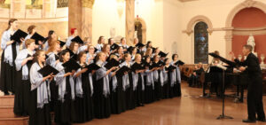 Choral students singing at a concert