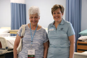 Janet Clark and Beth O'Connell standing in nursing lab