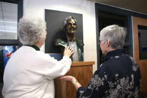 Barbara Doherty, SP, and Denise Wilkinson, SP admiring the statue