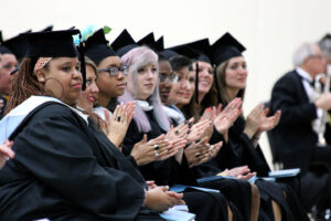 Students clapping at graduation