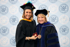 Student receiving academic excellence medal