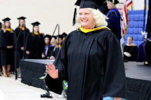 Student walking during commencement