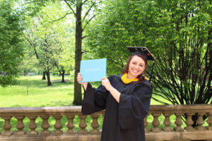 Woods Online student with her diploma