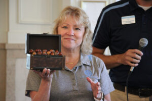 President King holding box of acorns